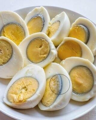 Why is the yolk of my hard-boiled egg turning green?