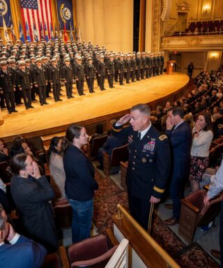 My family thought I’d quietly left the Navy, so I stayed silent at my brother’s SEAL graduation — until a general suddenly stiffened, saluted, and said, “Colonel… you’re here?”